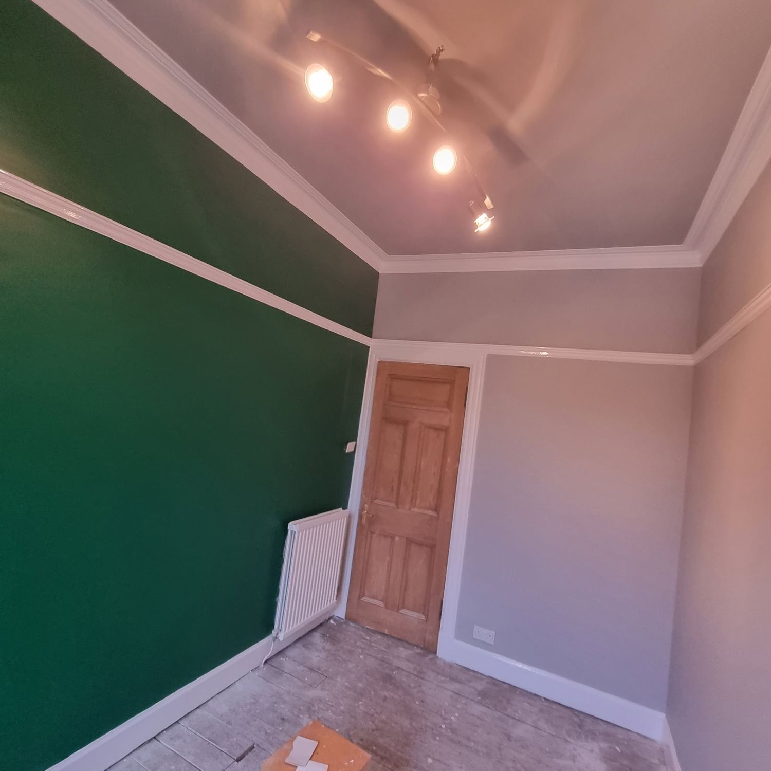 Deep green feature wall in a decorated Glasgow home