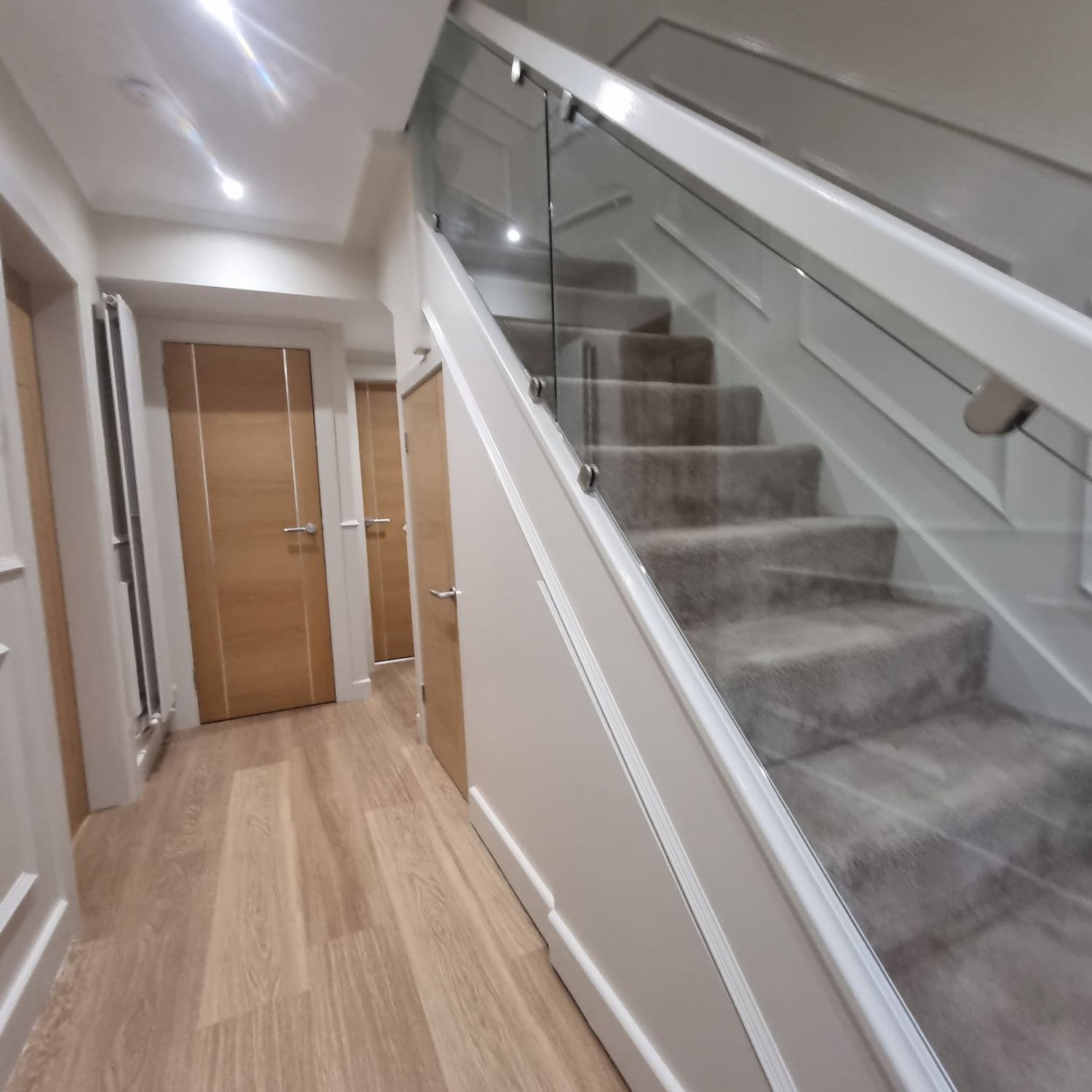 Decorative stair panelling finished in white in Rutherglen